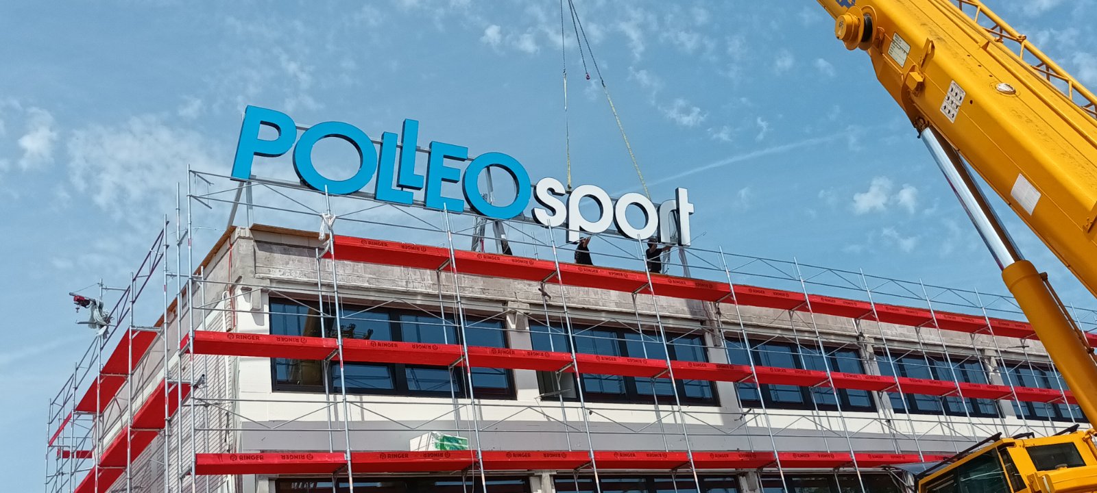 The illuminated advertisement for the Polleo Sport administrative building
